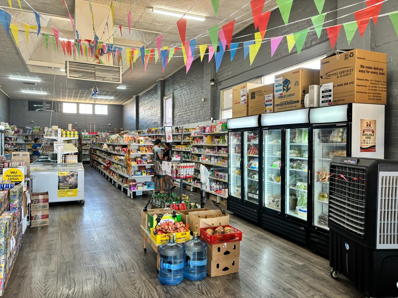 Wide view inside Filmart Asian Shop showing aisles and freezers